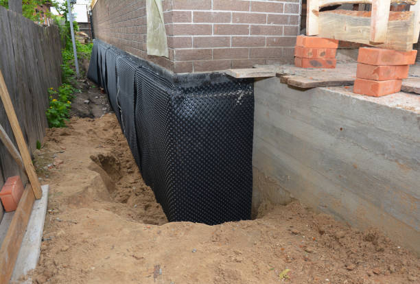 SJ Waterproofing Pros technician performing targeted Waterproofing assessment in Westport, WA